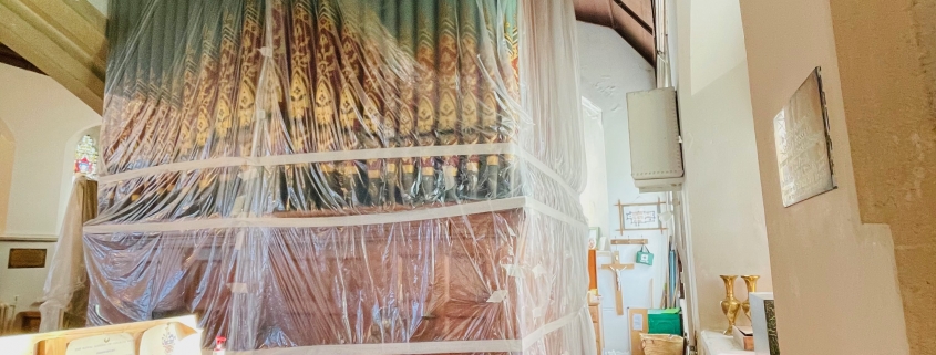 Our church organ all wrapped up to protect it from dust.